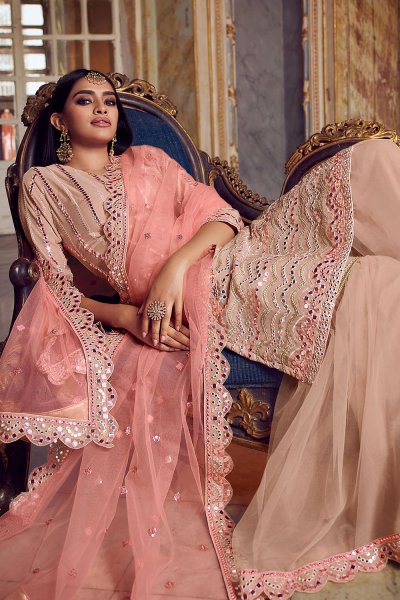 Powder Peach Sharara Suit In Georgette With Matching Net 