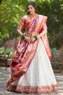 Off White & Peach Paithani Silk Zari Woven Lehenga Set With Potli Bag