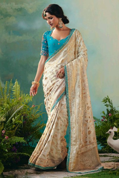 Ivory Zari Woven Silk Saree With Turquoise Embroidered Blouse Ivory Zari Woven Silk Saree With Turquoise Embroidered Blouse