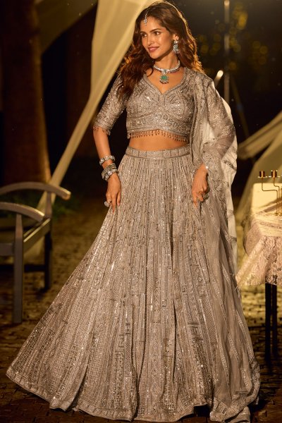 Shimmering Champagne Silver Net Embroidered Designer Lehenga Set Shimmering Champagne Silver Net Embroidered Designer Lehenga Set