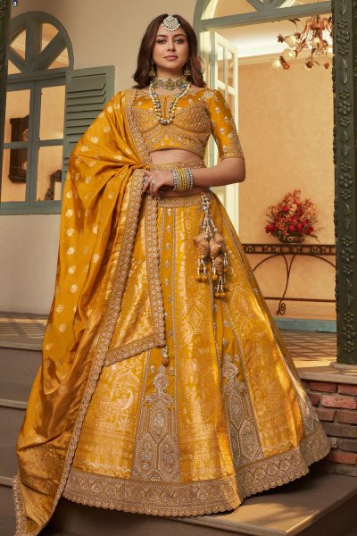Mustard Yellow Banarasi Silk Zari Woven & EMbroidered Lehenga Set With Belt Mustard Yellow Banarasi Silk Zari Woven & EMbroidered Lehenga Set With Belt