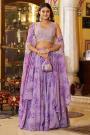 Lilac Georgette Printed And Embroidered Lehenga And Top With Cape And Potli Bag